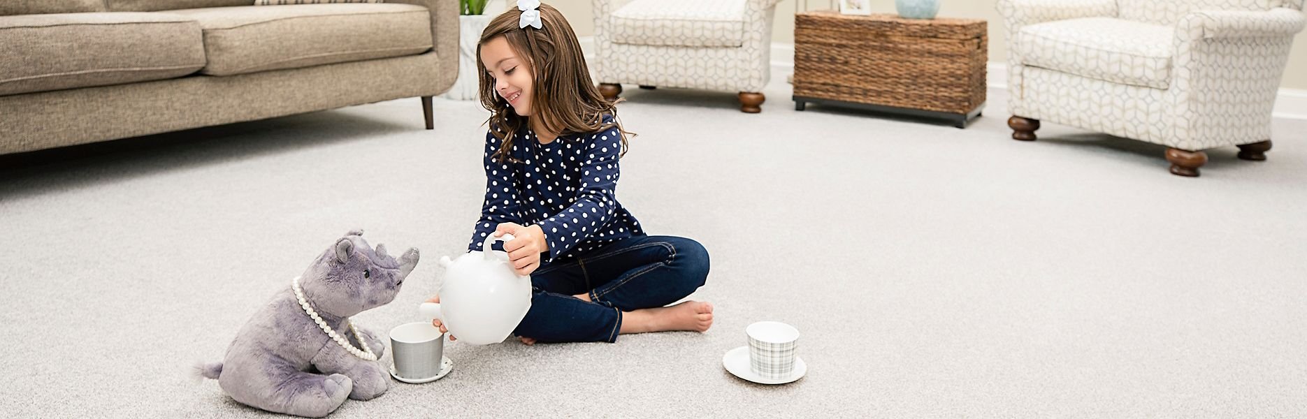 Girl playing with toys on a SmartStrand carpet